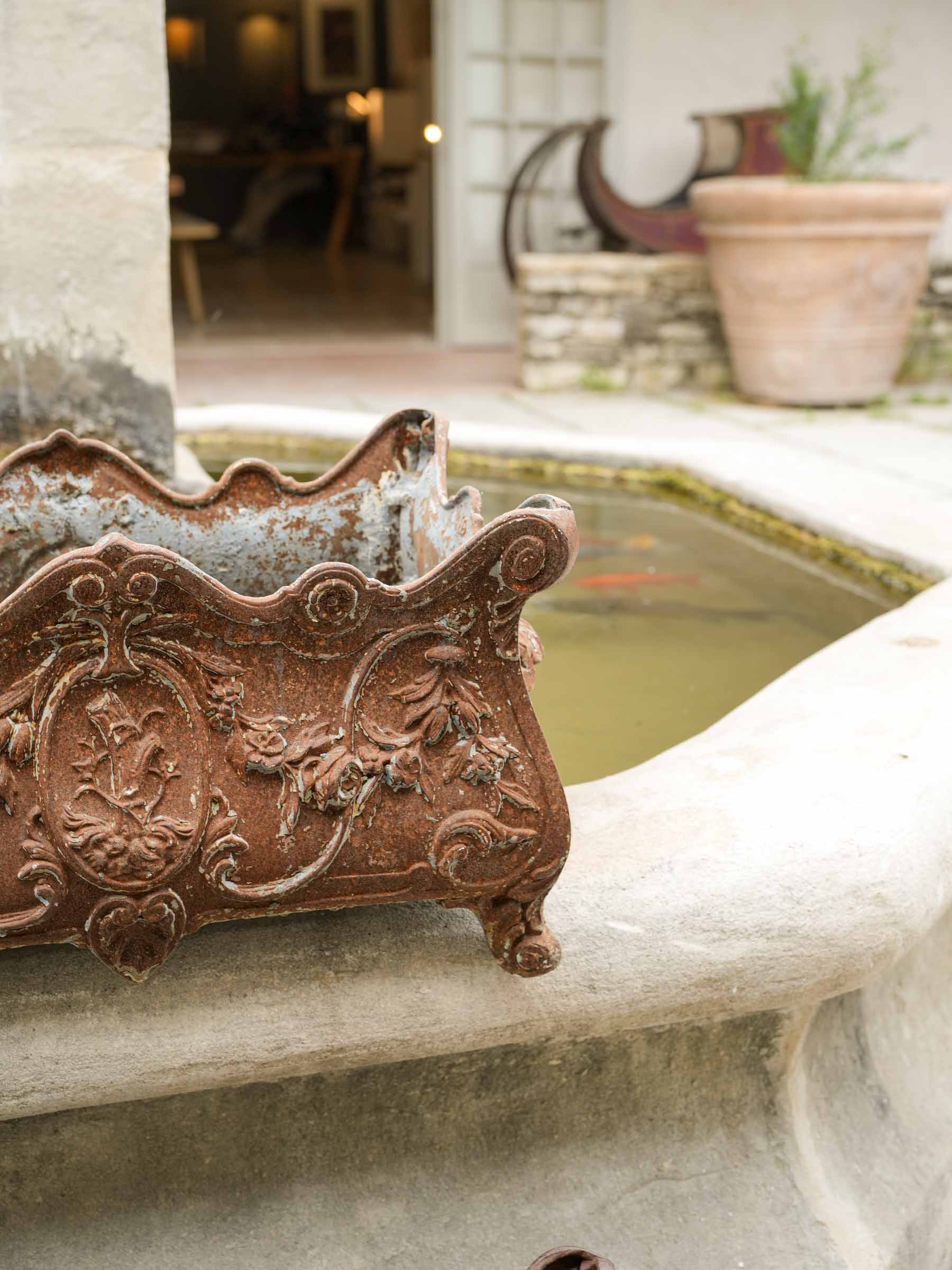 Timelessly aged ornate jardinieres  