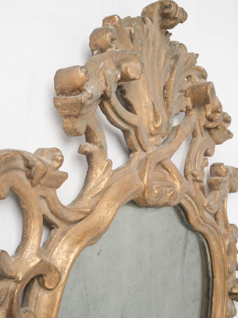 Intricate scrolling acanthus leaf sconces