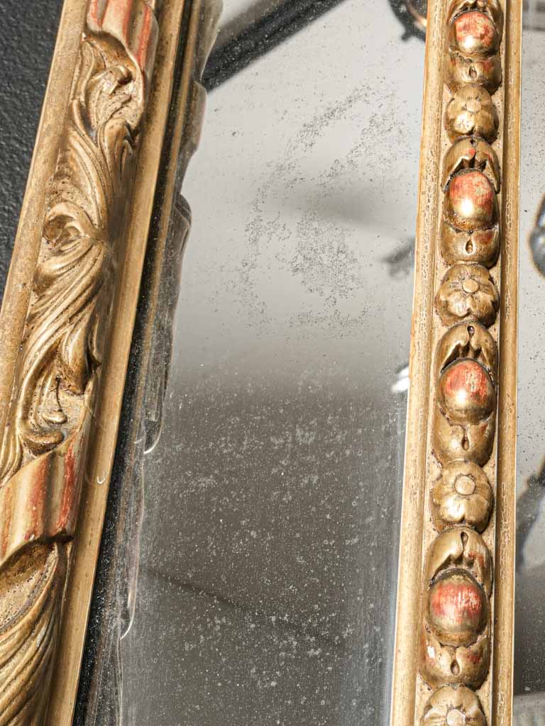 Richly detailed beveled mercury glass