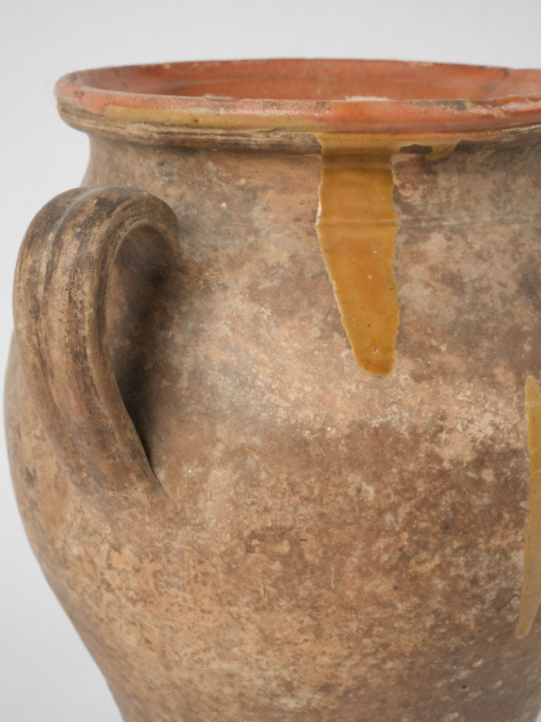 Time-worn unglazed pot with handles
