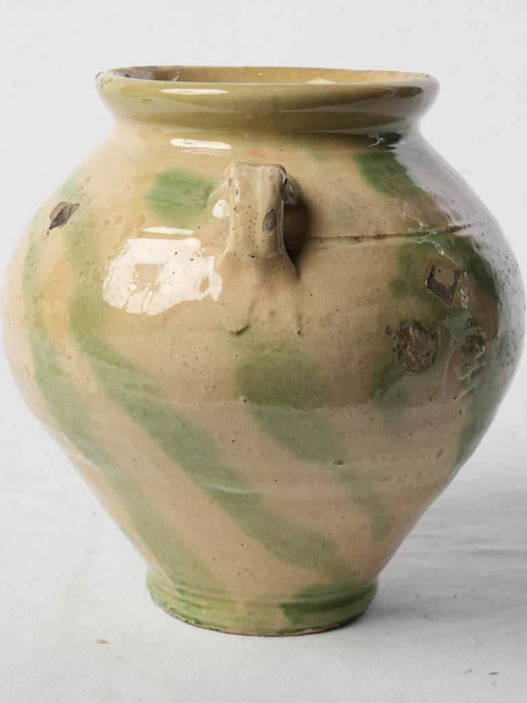 Glazed antique cream-green pot