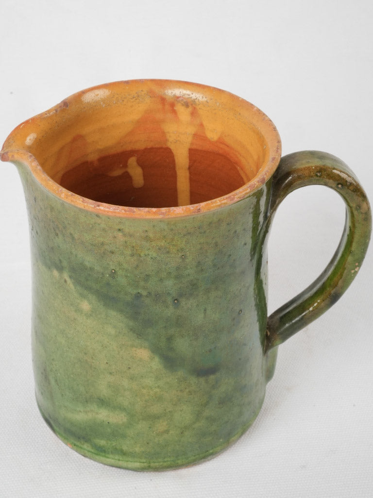 Rustic-style French green ceramic pitcher