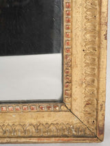 Opulent, timeworn gilded mirror