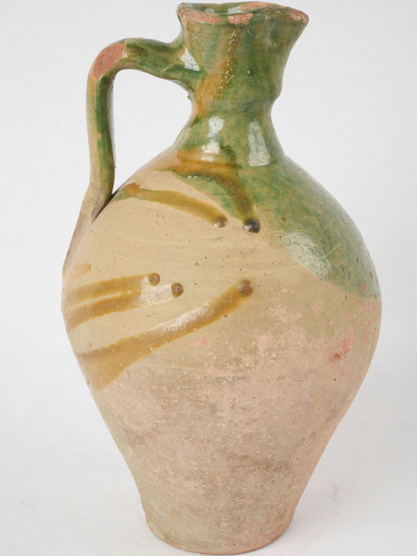Antique French green-glazed ceramic pitcher