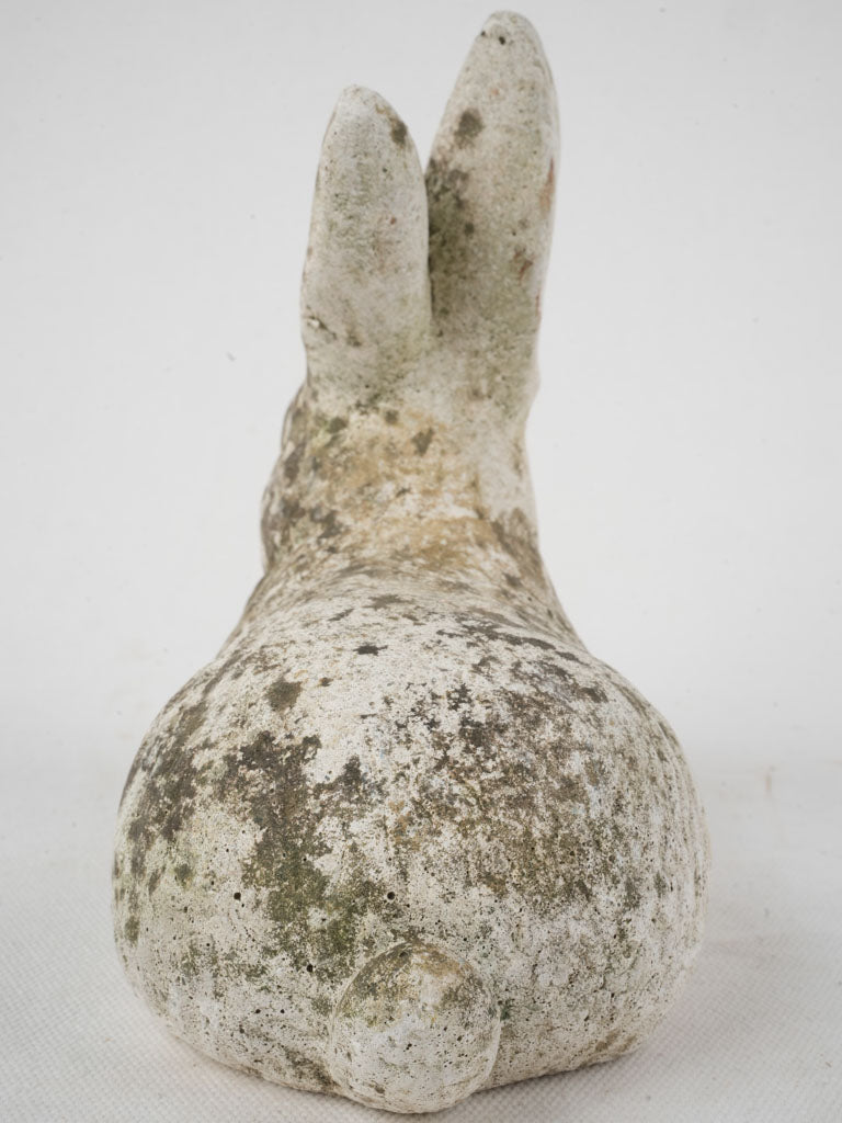 Charming aged cement bunny ornament