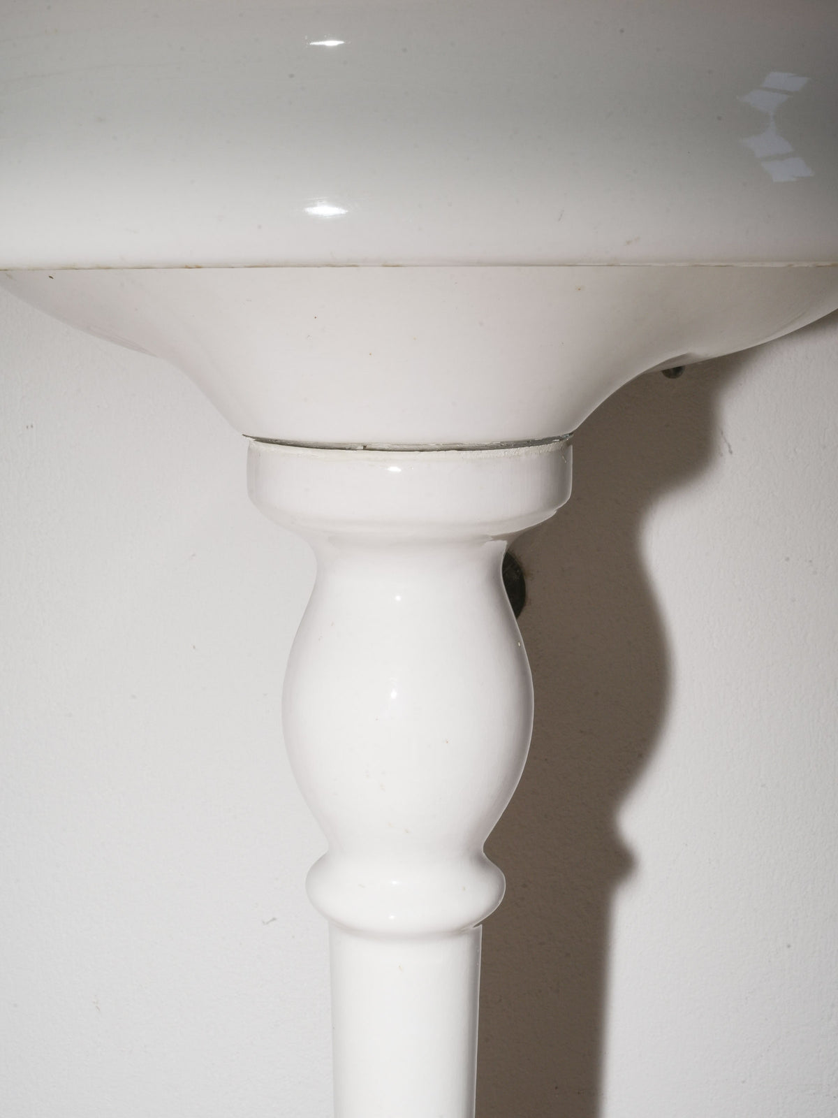 White Porcelain Wall-Mounted Washbasin with Brass Taps