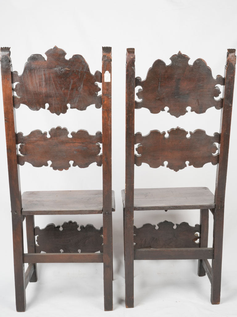 Intricately carved high-back chairs