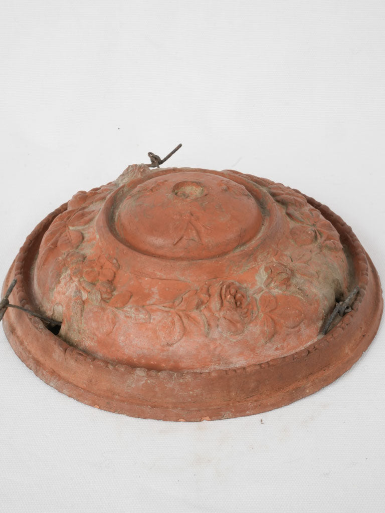 Handcrafted rose-adorned terracotta pot