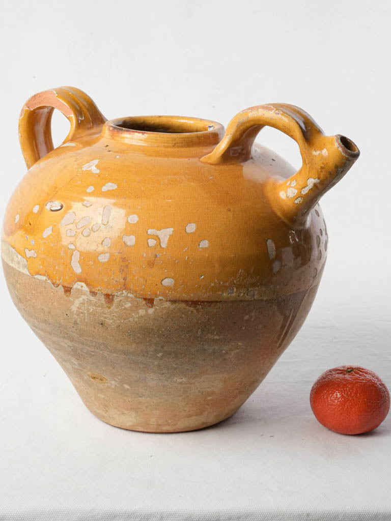 Vintage ochre-glazed pottery vessel  