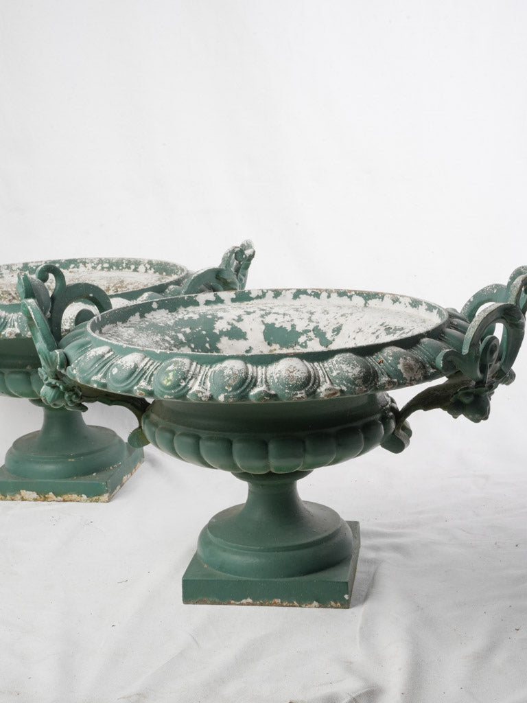 Aged cast-iron garden urns  