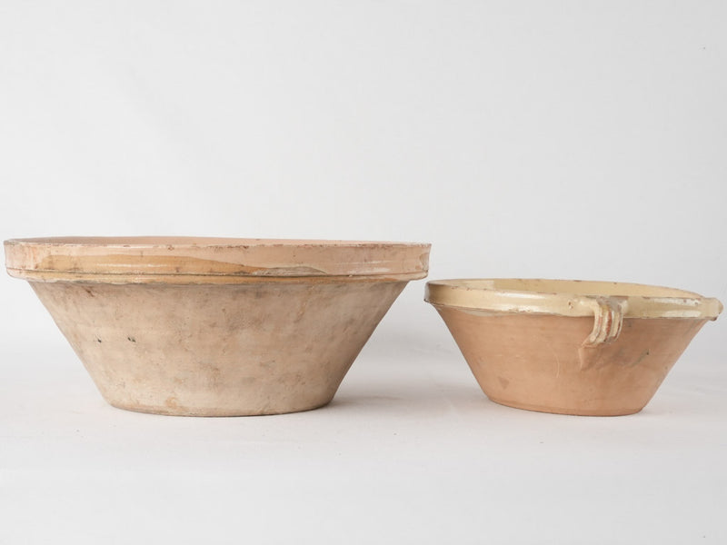 2 terracotta bowls w/ creamy yellow glaze