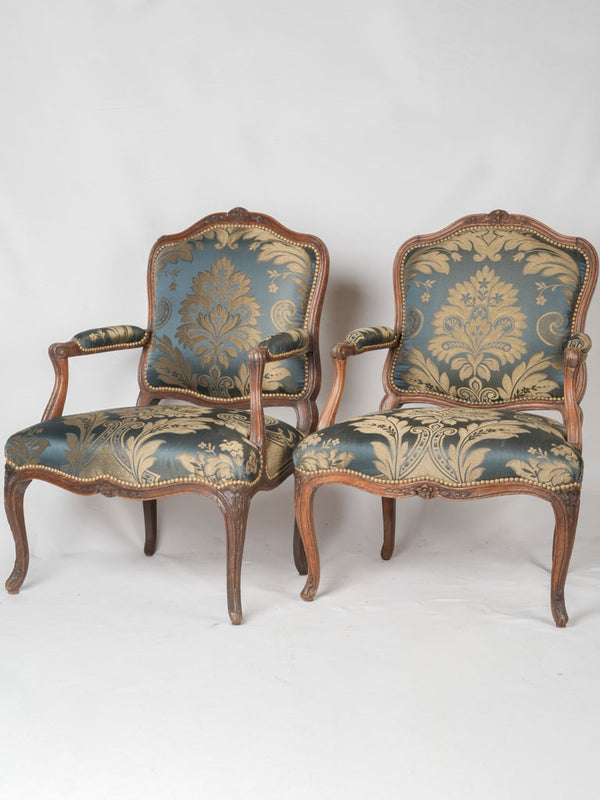 Ornate Louis XV peacock silk armchairs