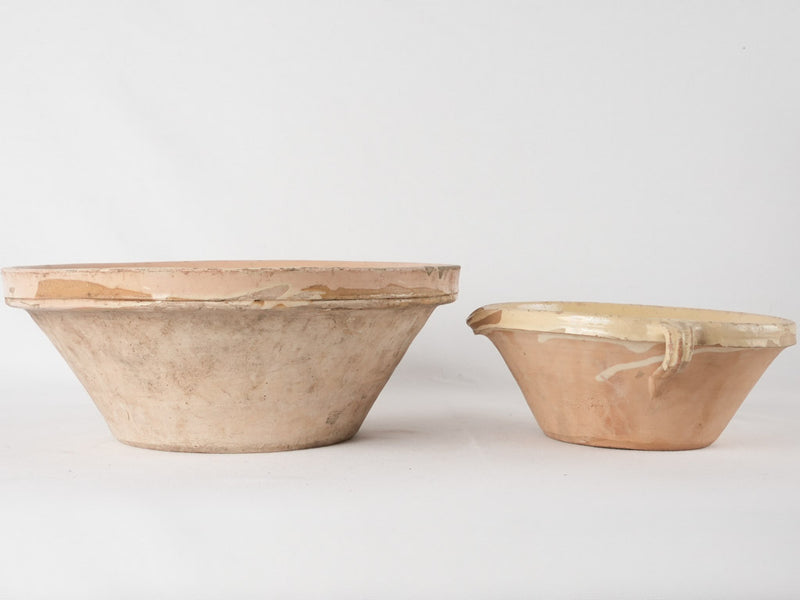 2 terracotta bowls w/ creamy yellow glaze
