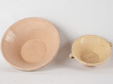 2 terracotta bowls w/ creamy yellow glaze