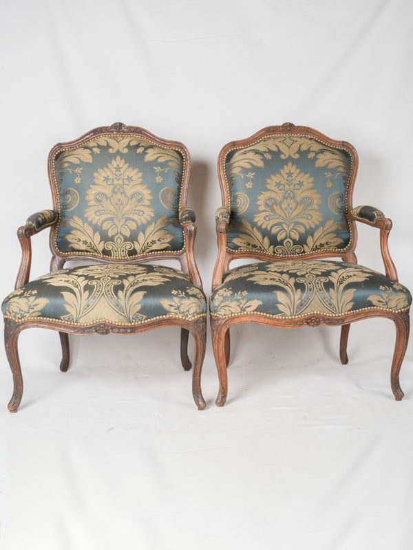 Elegant French oak floral armchairs