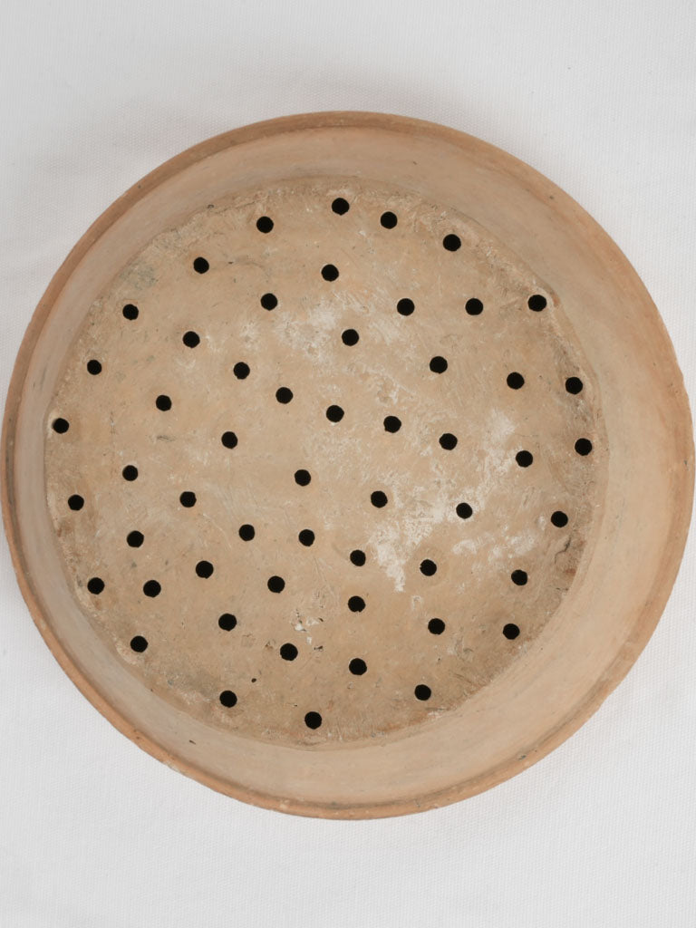 Time-worn terracotta berry washing bowl
