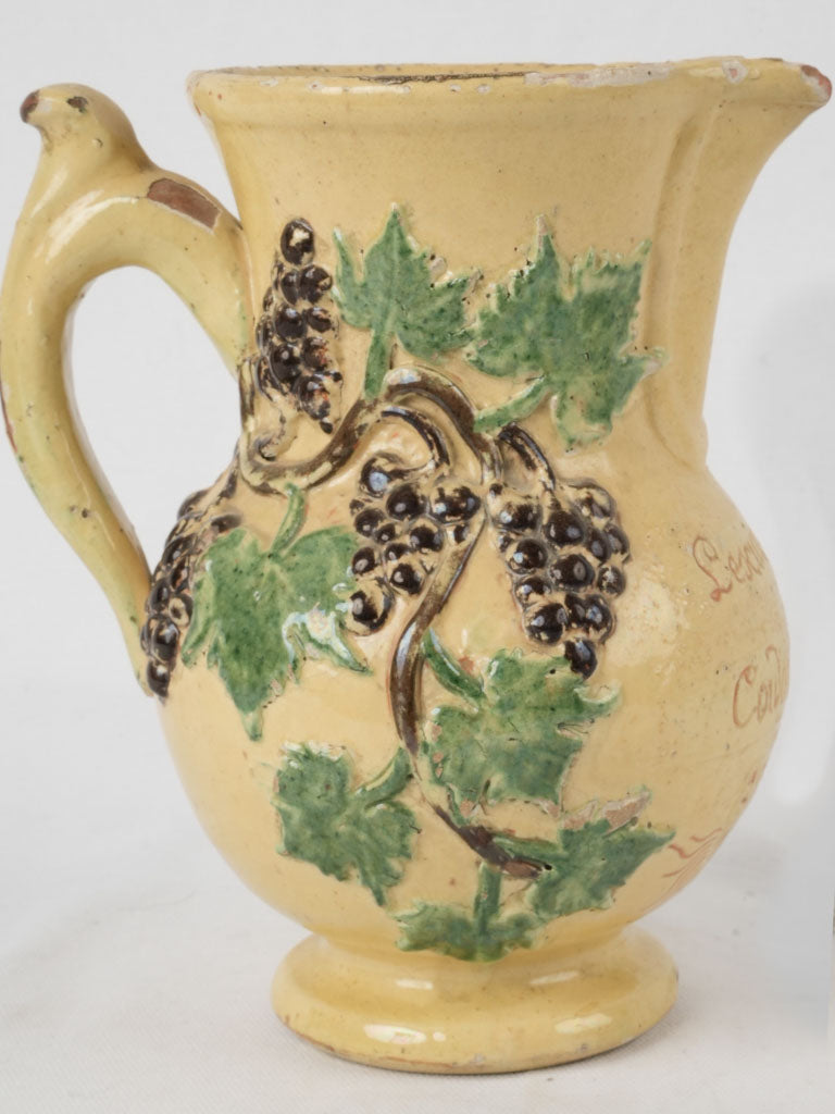 Antique yellow engraved ceramic pitcher