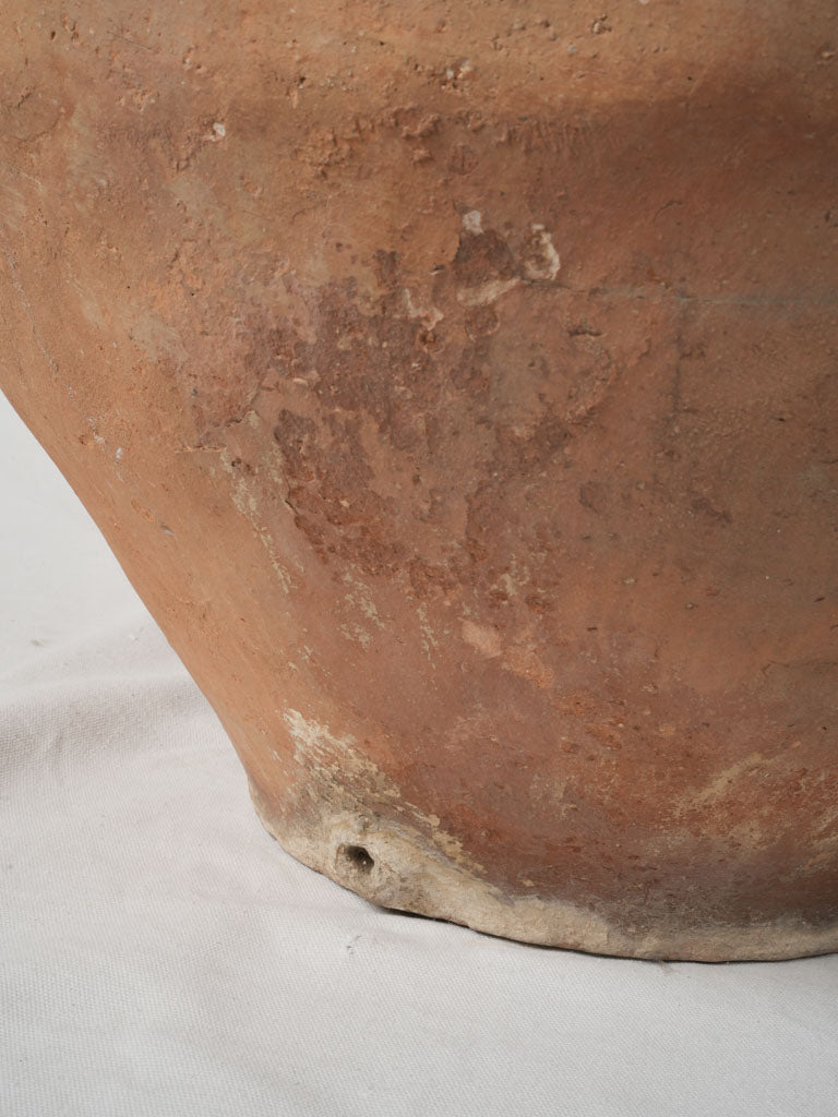 Aged unglazed clay terracotta decorative piece