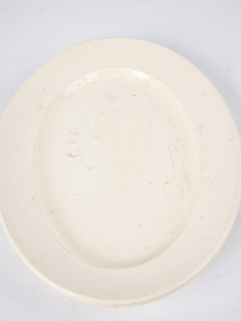 Collectible cream-colored antique earthenware