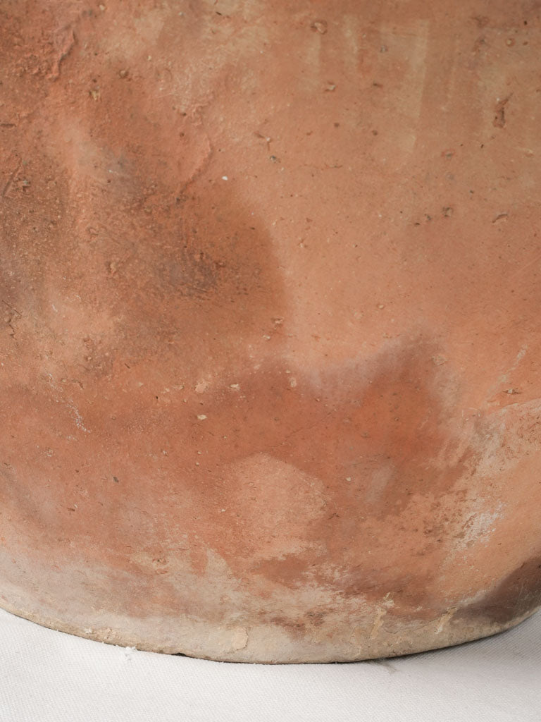 Antique patina-rich unglazed clay pot