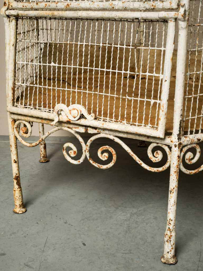 Historical cream iron aviary