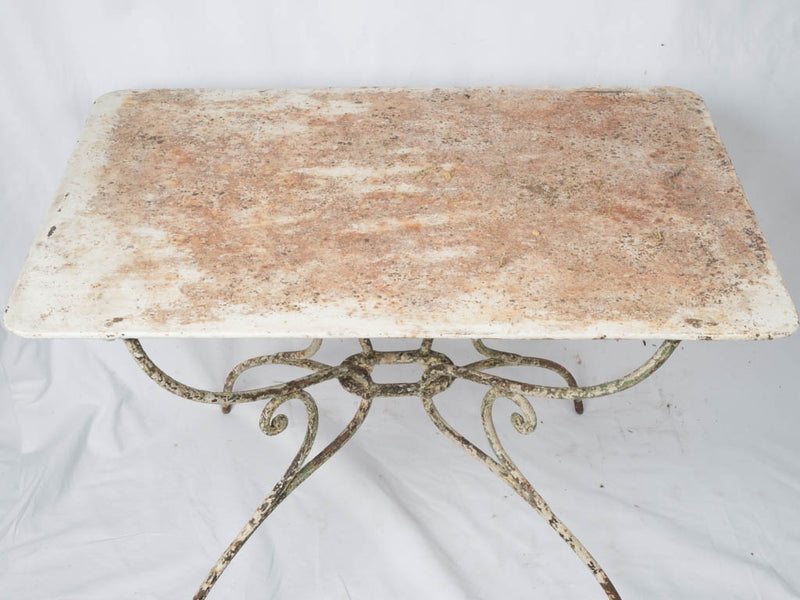 Worn wrought iron rectangular table