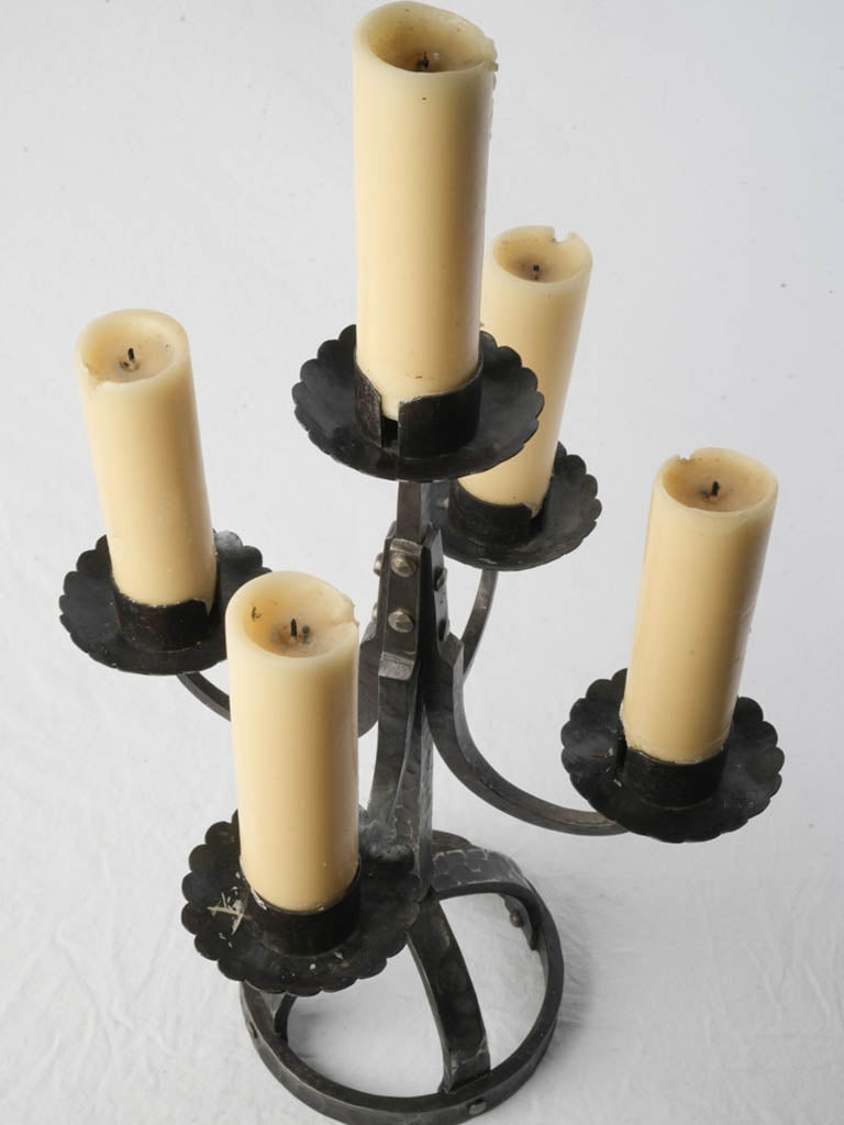Artisanal scalloped iron candle feature
