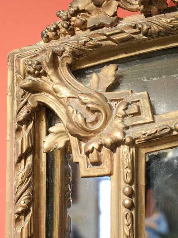 Ornate, gilded Louis XVI mirror