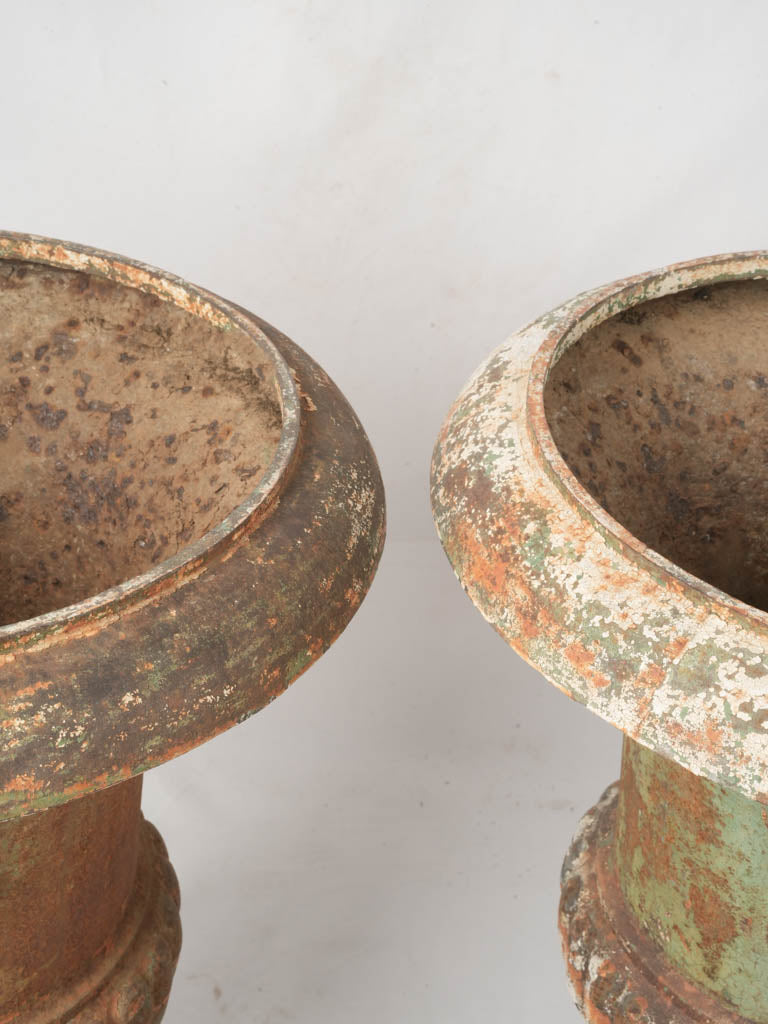 Ornate classical cast iron urns  