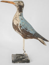 Colorful artisan-crafted bird sculpture ornament