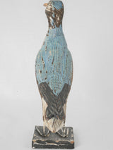 Antique hand-carved bird figurine accent