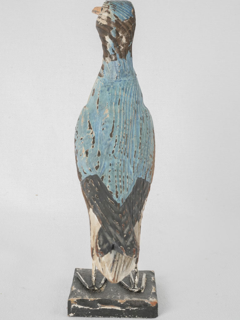 Antique hand-carved bird figurine accent