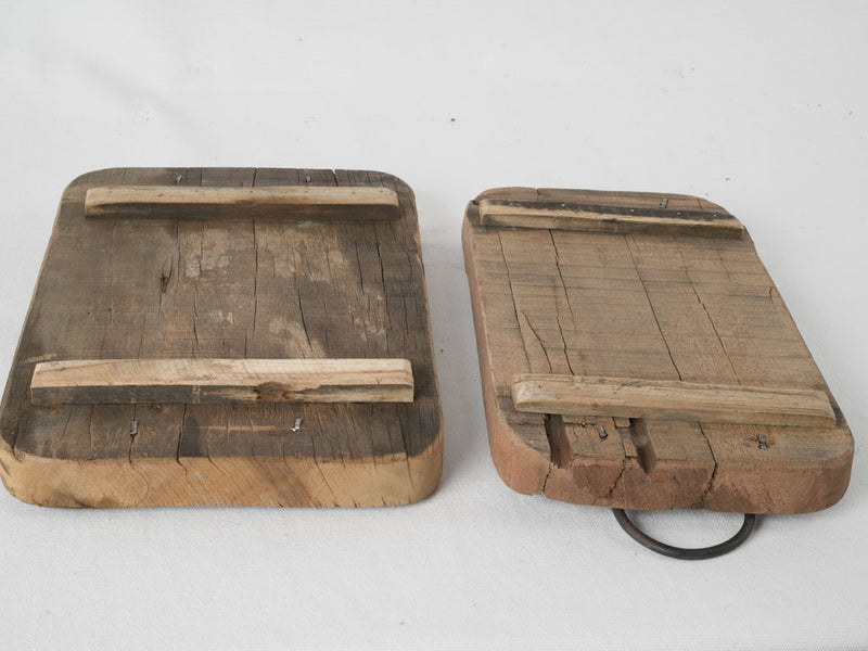 Rustic 1930s iron-handled chopping boards