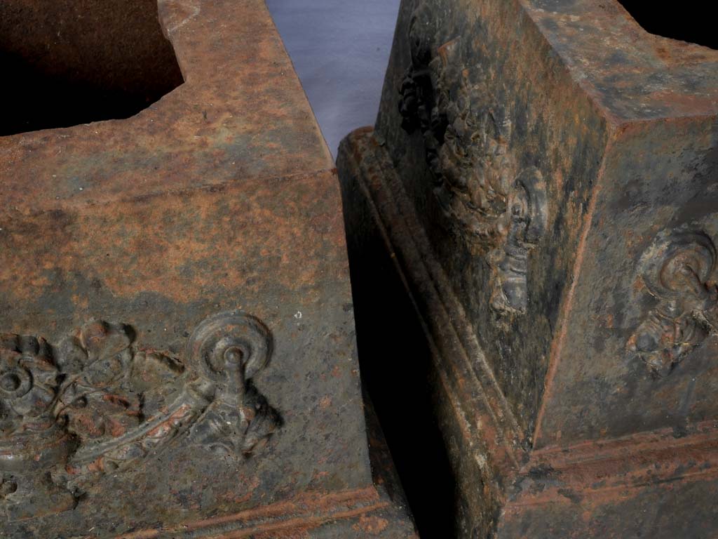 Urn-adorned cast-iron bases