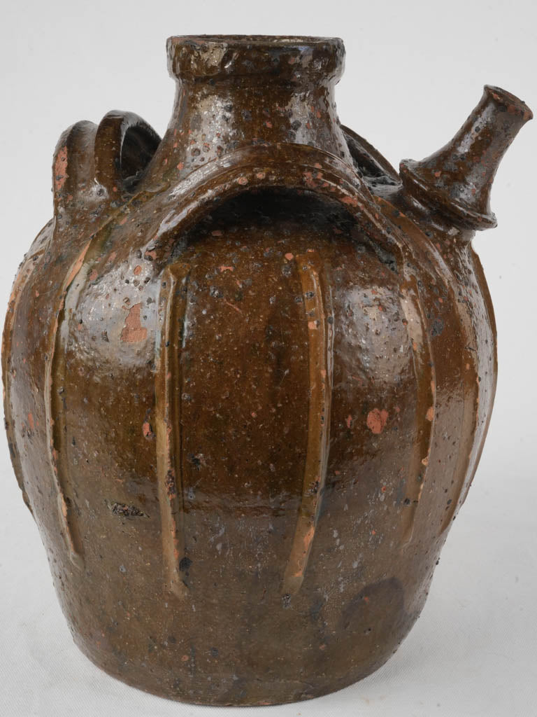 Traditional gnarly-designed oil jar  