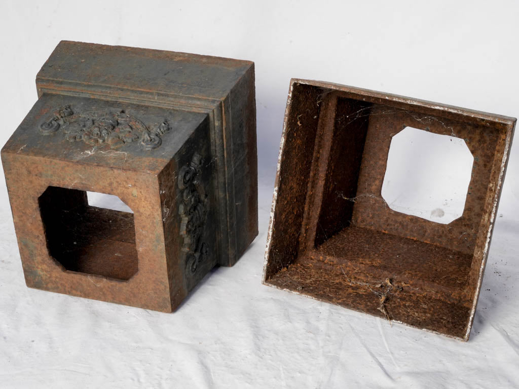 Timeworn ornate iron pedestals