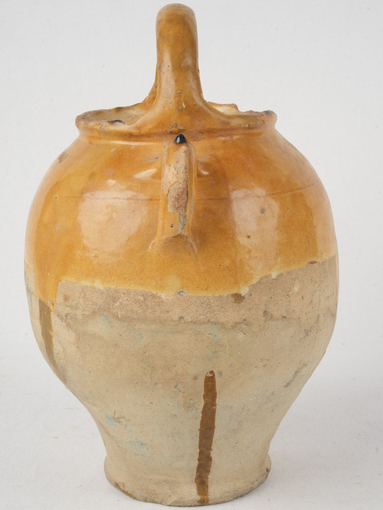 Preserved ocher ceramic repair jug