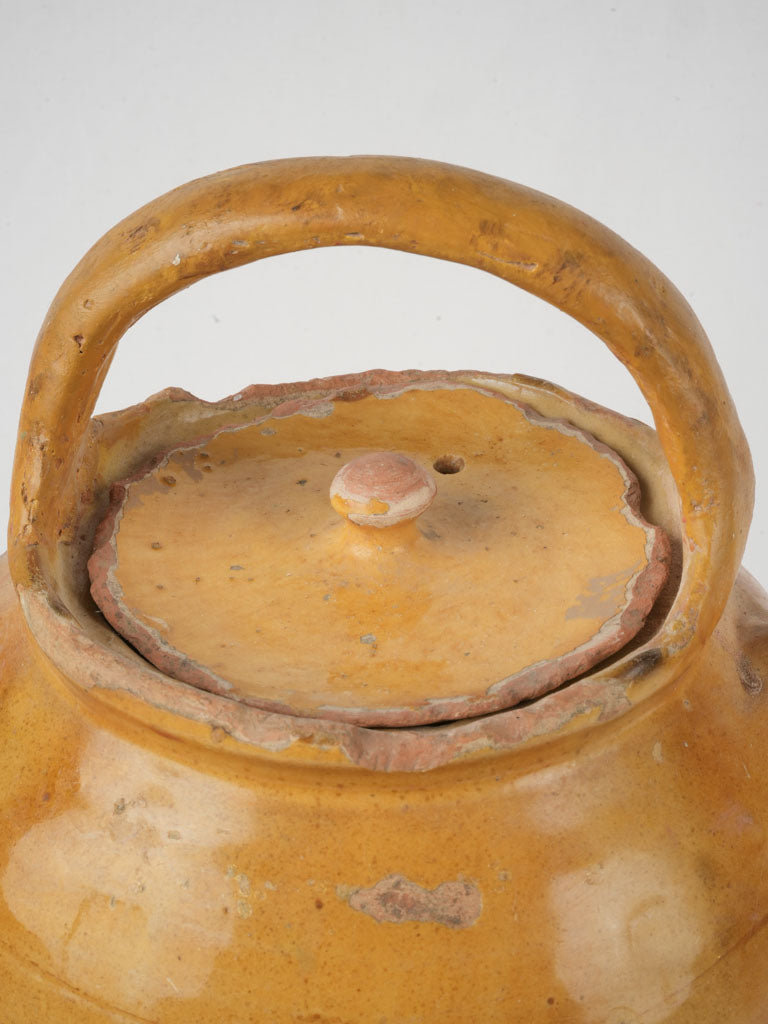 Distinctive ocher half-glazed vessel