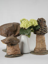 Rustic, earthy field mushroom sculptures