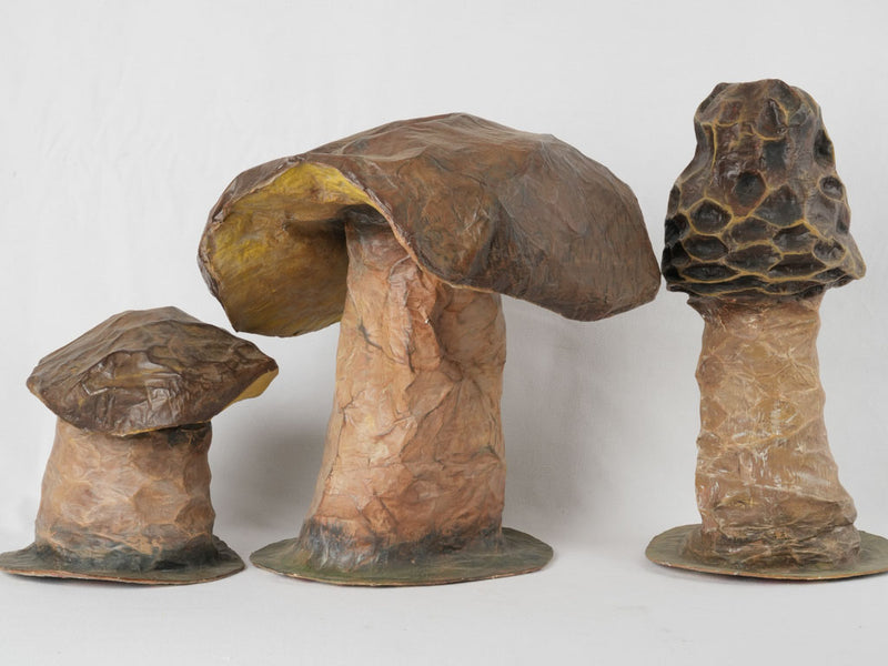 Aged, whimsical papier mâché mushroom sculptures