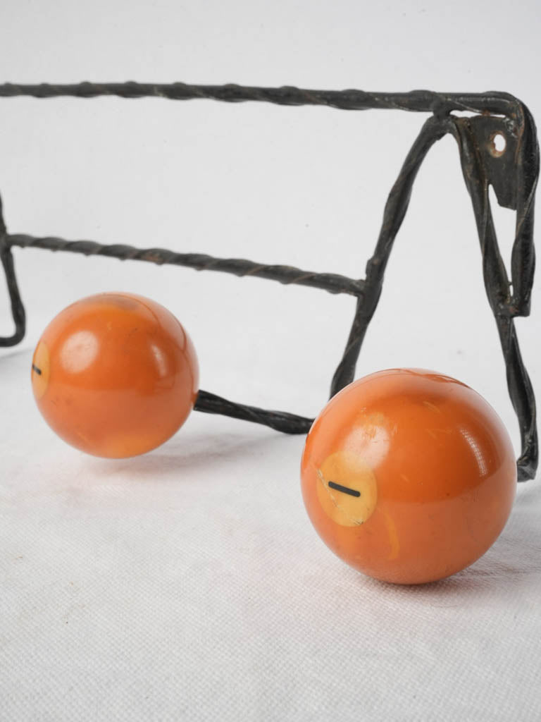 Aged twisted metal wall-mounted rack  