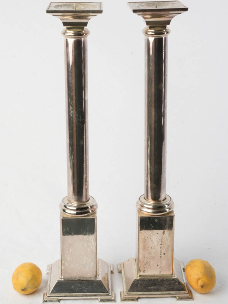 Antique silvered metal candle holders