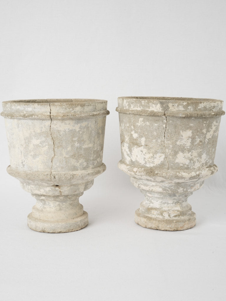 Classic patina-enhanced concrete pair urns