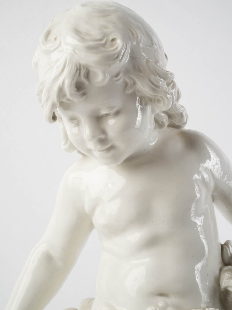 Luminous white cherubic porcelain sculpture  