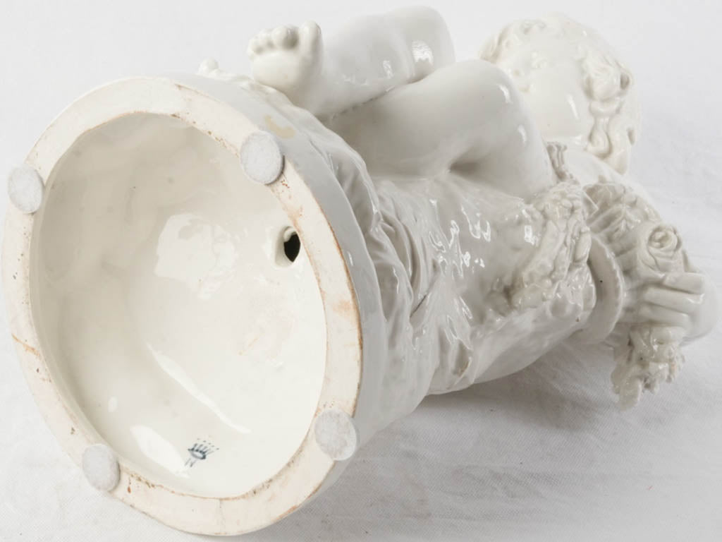 Decorative antique floral cherub figurine  