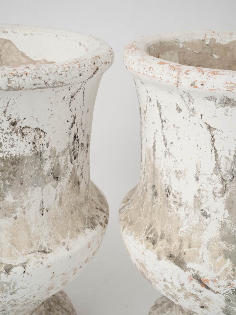 Charming old-world concrete urn pair