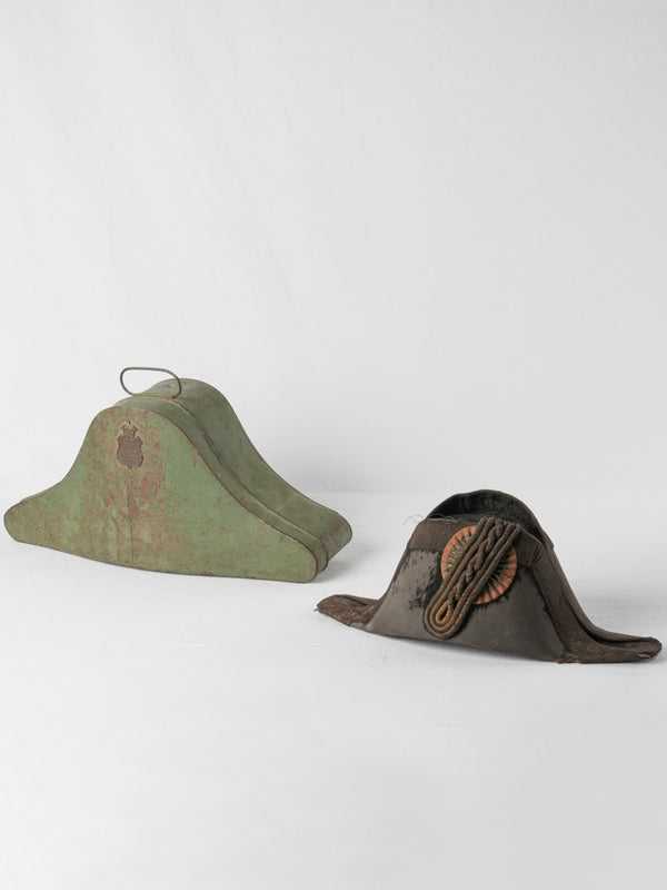 Antique military bicorn hat with badge