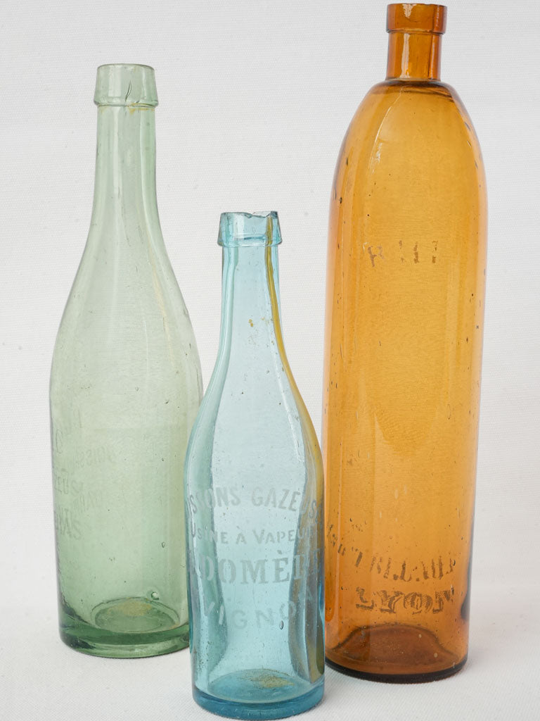 Vintage French glass bottles trio