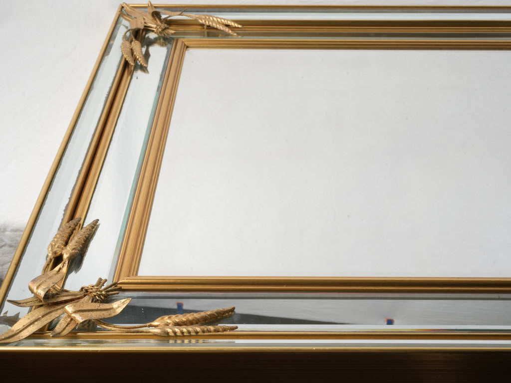 Stylish mirror with gilt molding.