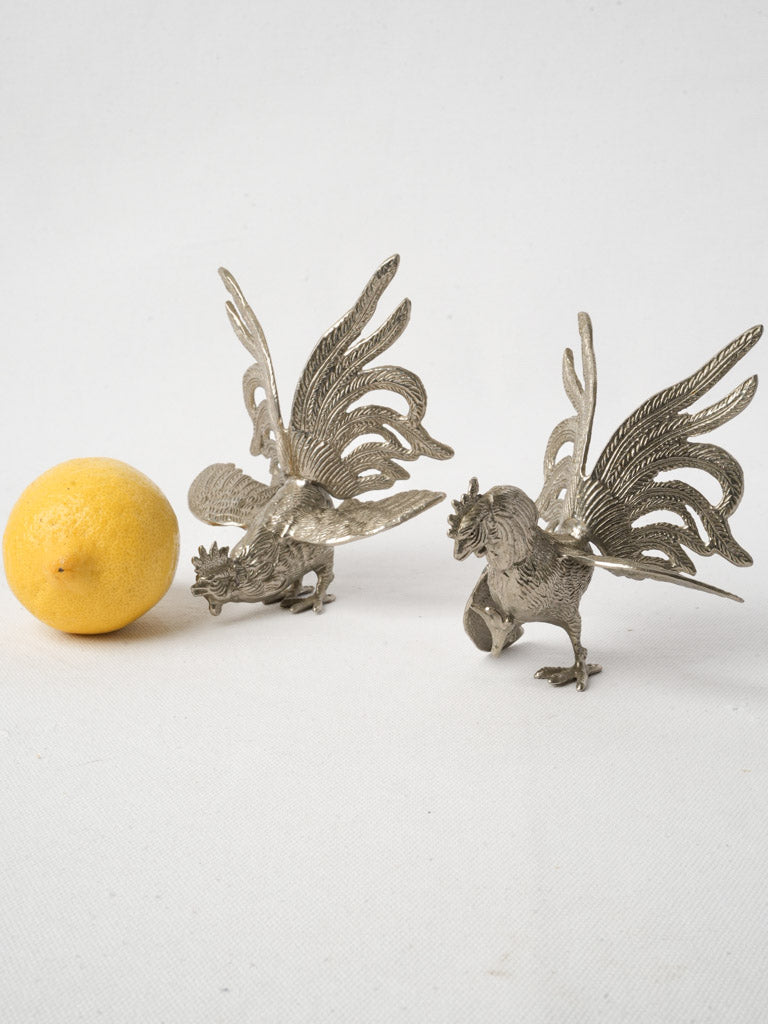 Silvered artisan crafted fighting cockerels